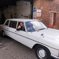 Lewis moving a customers car into the workshop